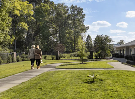 Two women walking on a sidewalk, one carrying a handbag. AI generated content